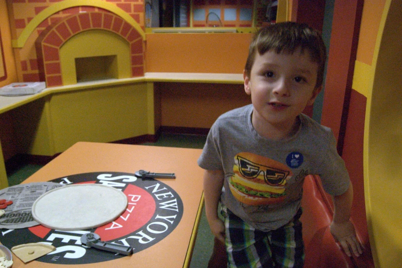 a  sits at a table inside a restaurant