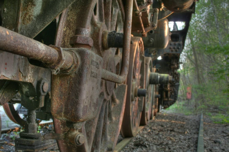an old dirty machinery is shown in the woods