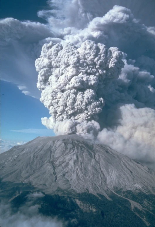 a very large column of smoke and ash as it comes from the volcano