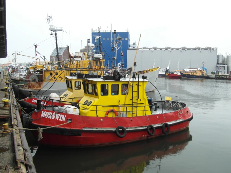 some boats docked in a body of water