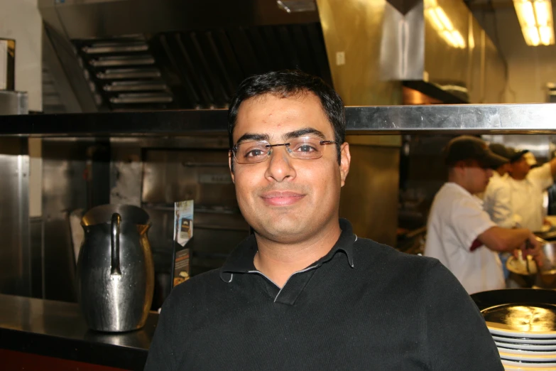 a person in a kitchen with food and utensils