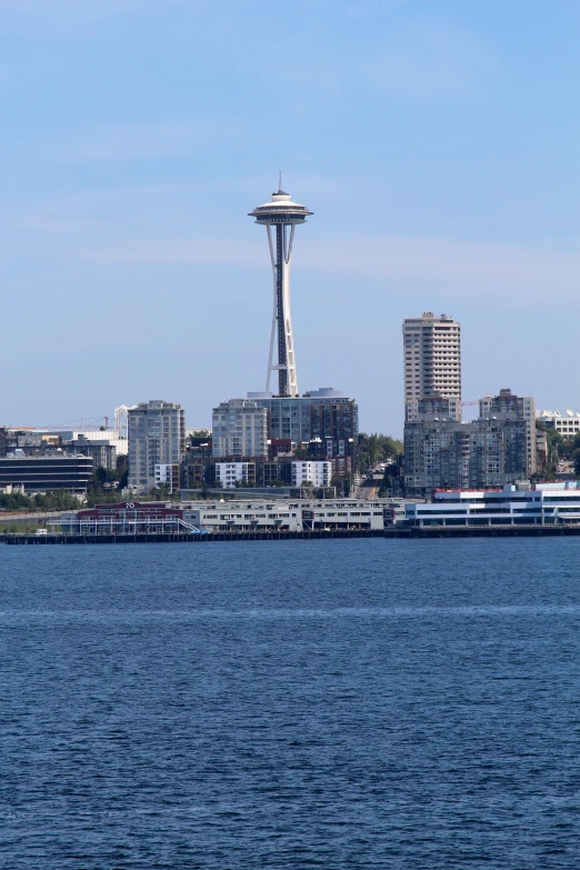 view of a space needle with water and boats