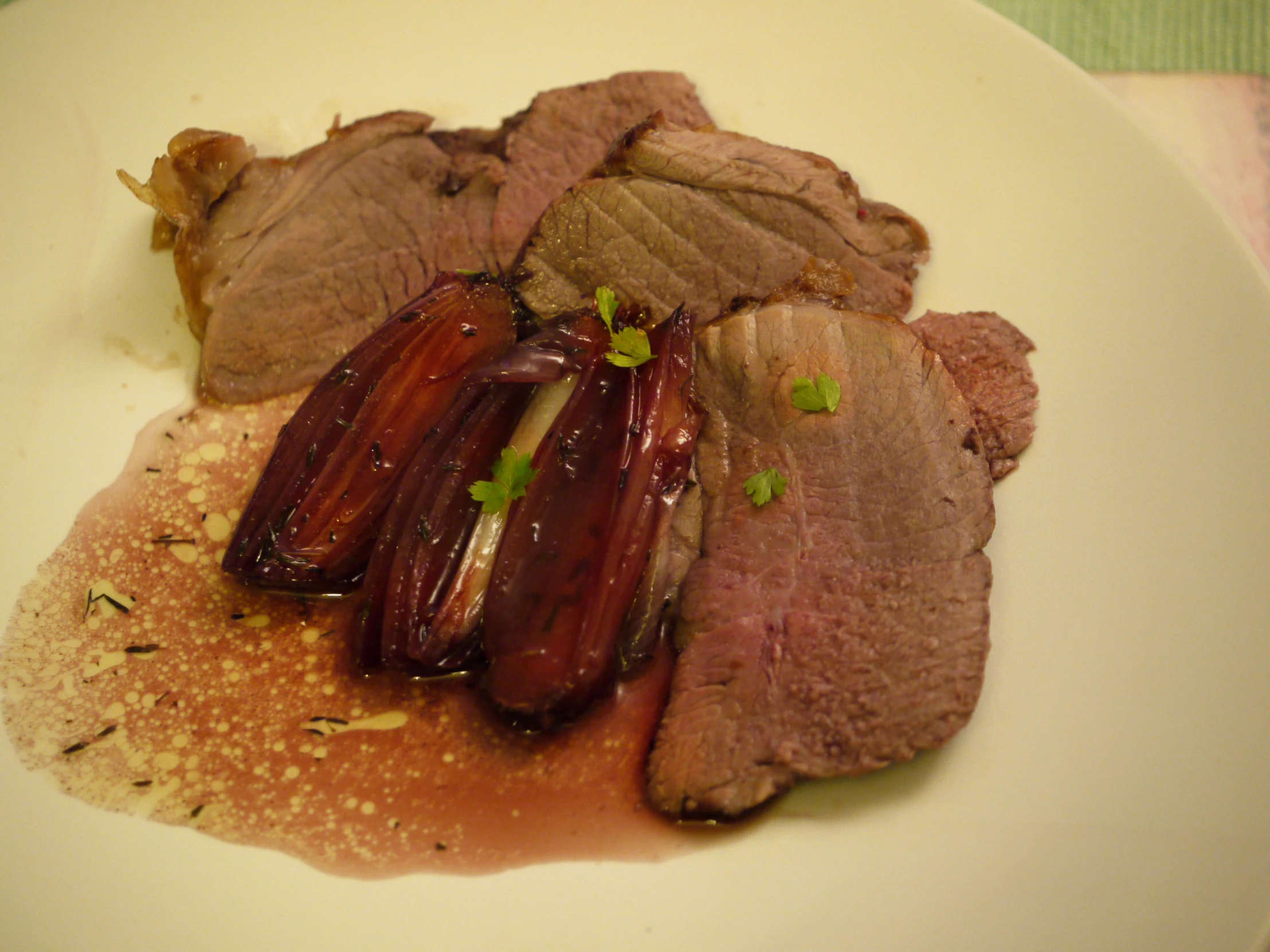 a close up of a plate of food with meat