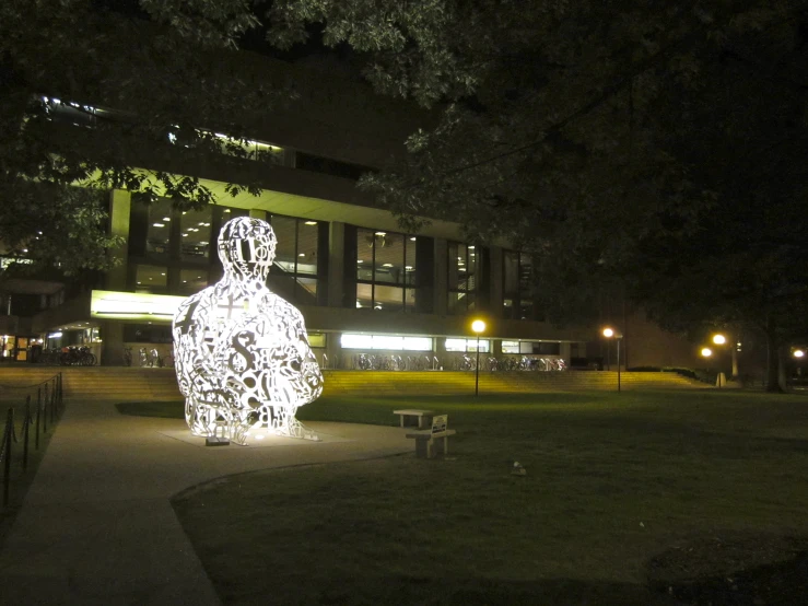 the statue is decorated in white light at night