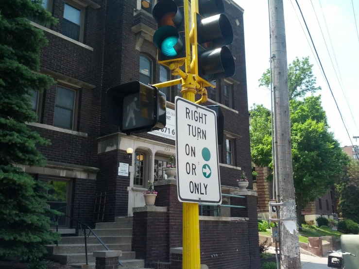 the traffic lights and signs are showing green light