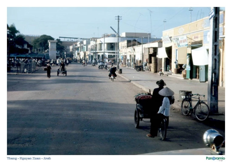 a small town street lined with tall buildings