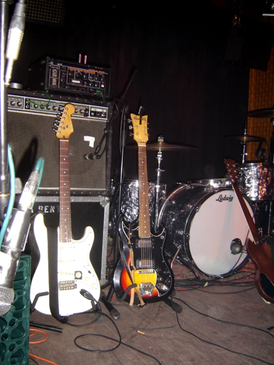 there are guitars and music equipment set up