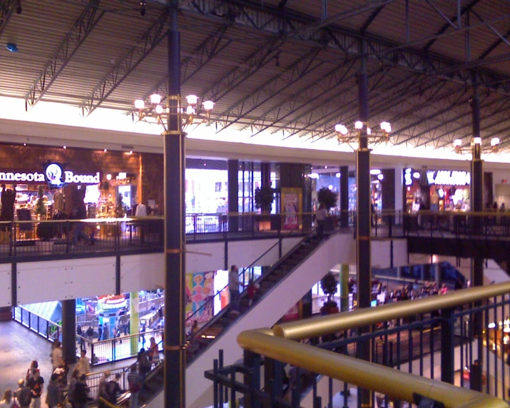 a view from above of people walking around an atrium of a building