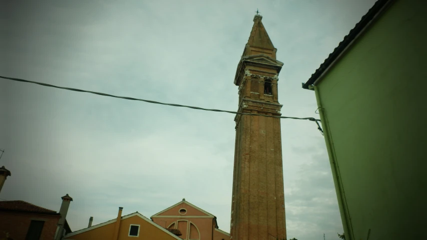 an old building is next to the power lines