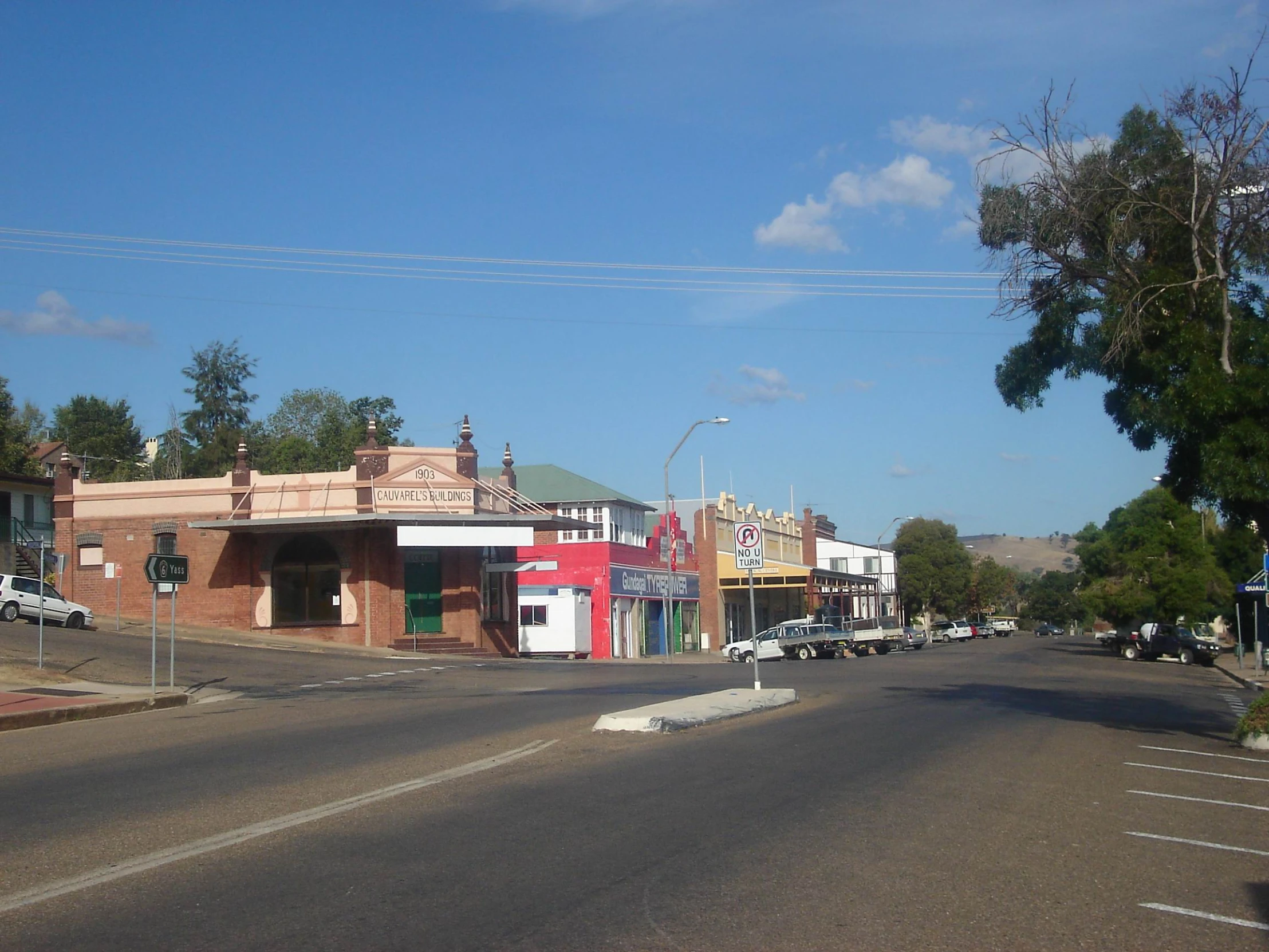 the city street has several buildings that have been boarded down