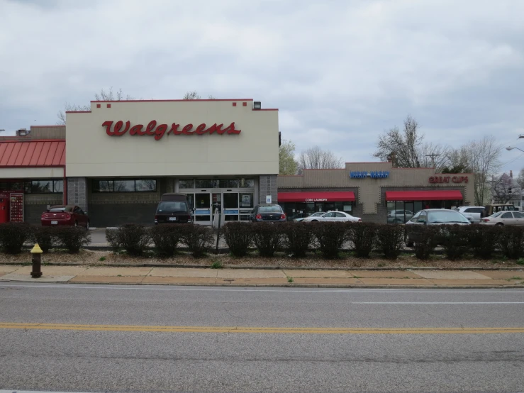 a restaurant called wallflowers has a sign over the front door