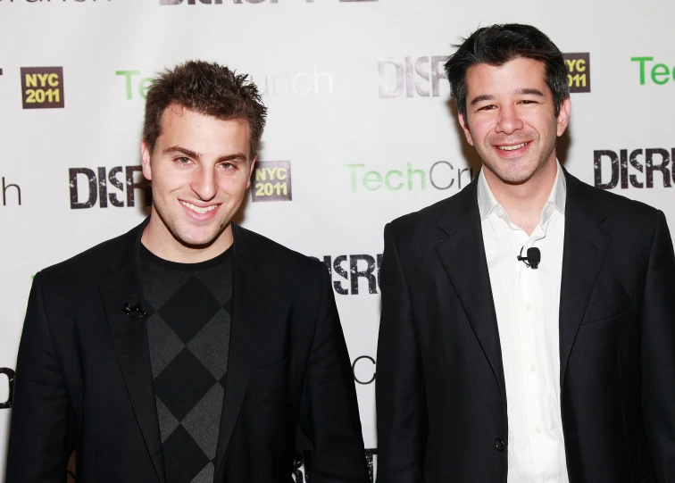 two young men standing next to each other