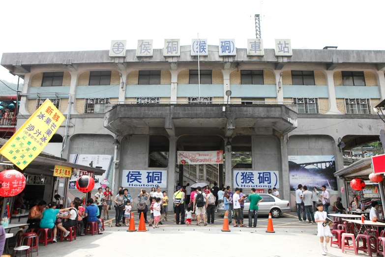 people standing in front of an old building