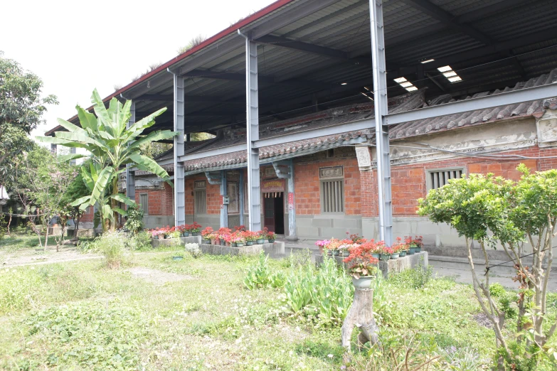 an old dilapidated building with large, metal columns