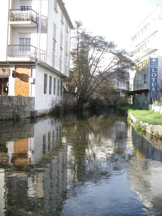 buildings along the bank and river flowing through them