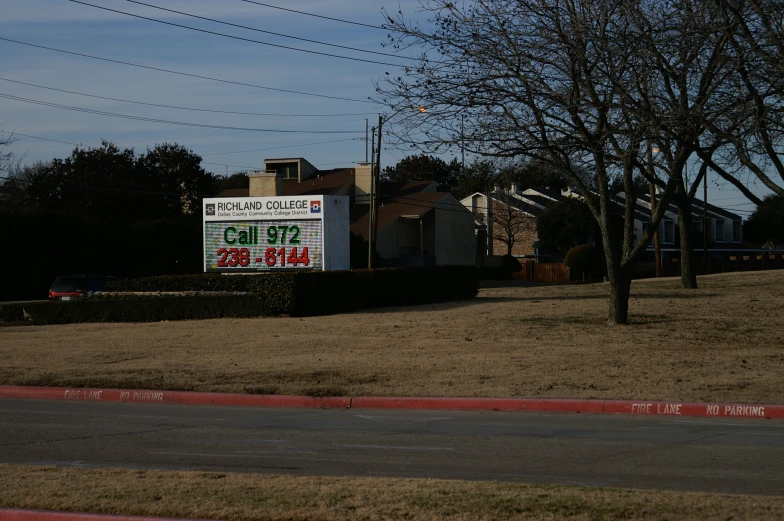 a street sign for an american restaurant on a hill