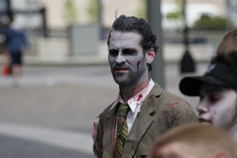 this is a man wearing makeup while dressed as a zombie