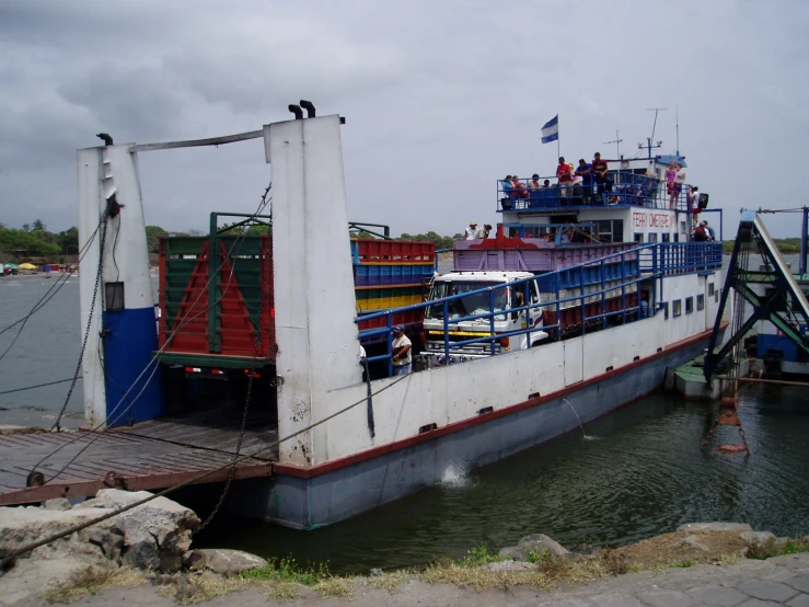 a large cargo ship docked at the pier