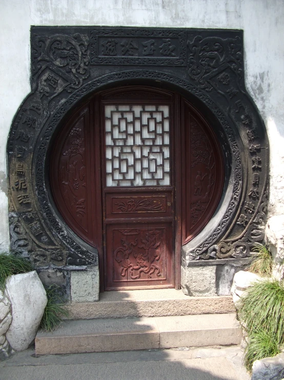 the entrance to the building features a circular design