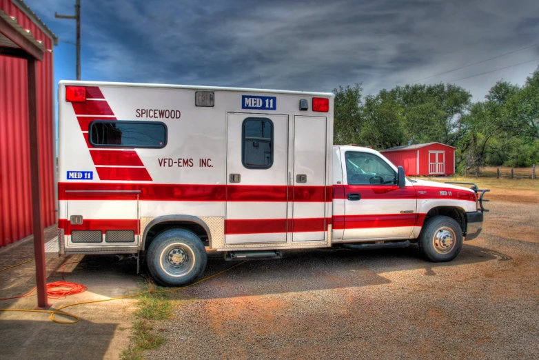 an ambulance has a red and white design on it