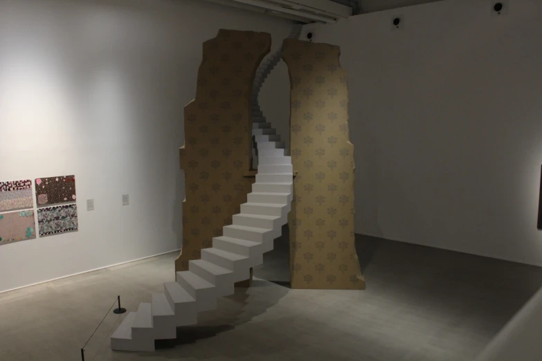 there are four sculptures in the shape of stairs