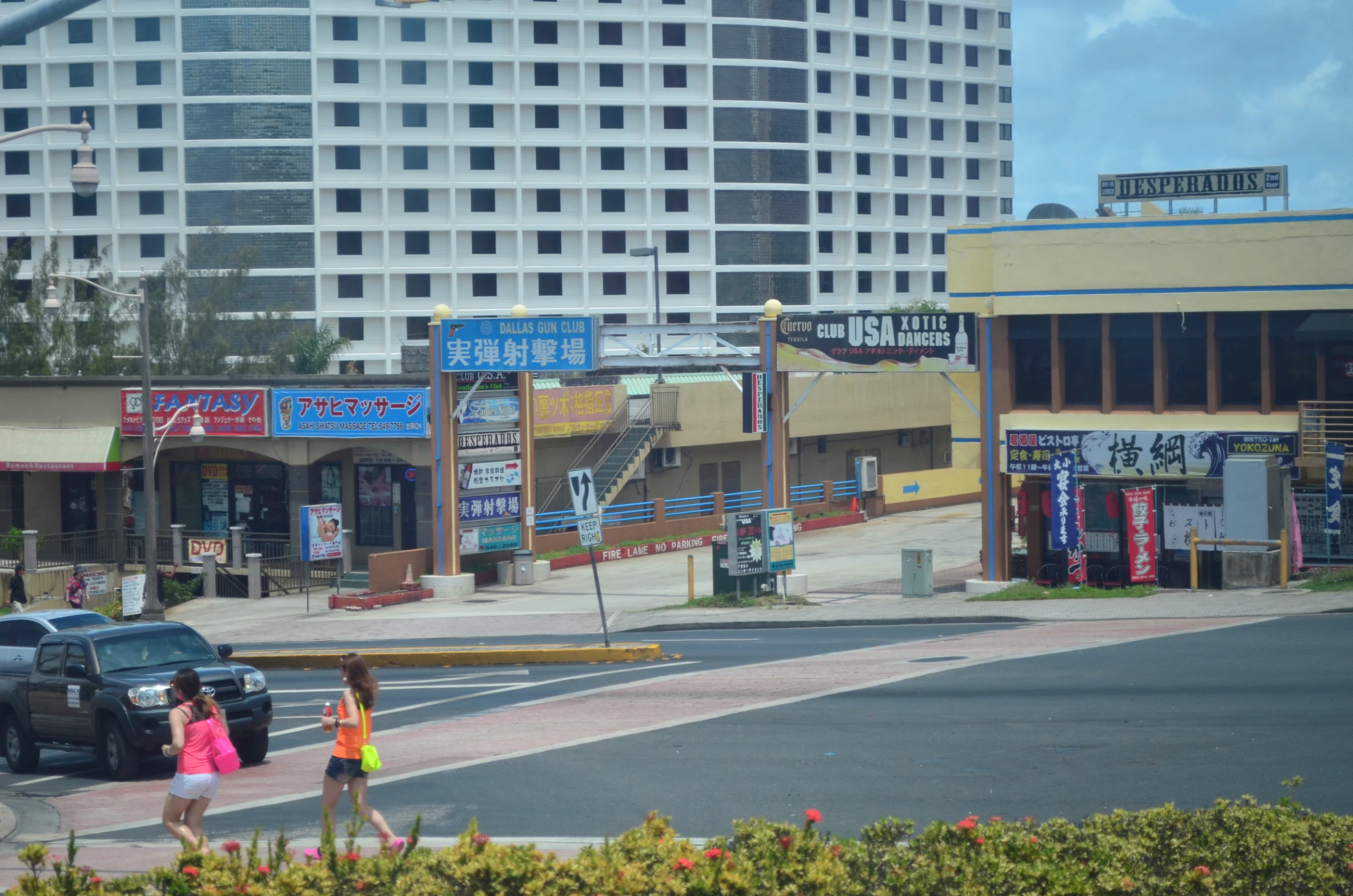 a group of people crossing a street in a city