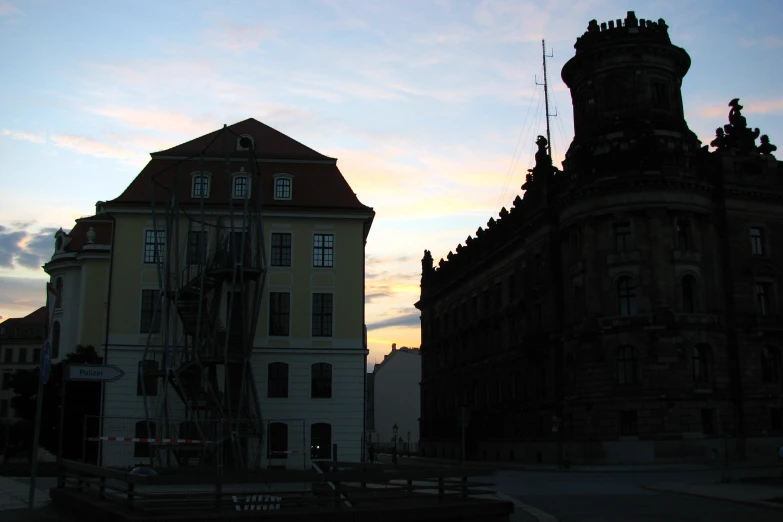 some buildings are next to each other and one building has windows