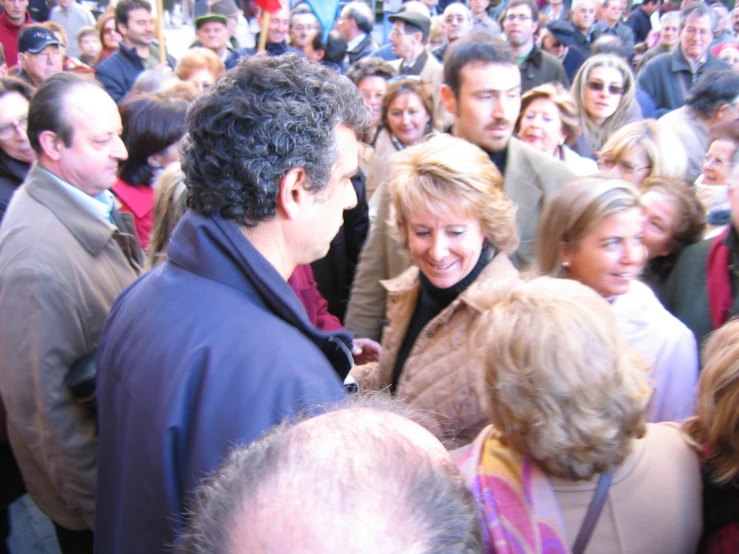 a group of people at a concert and talking