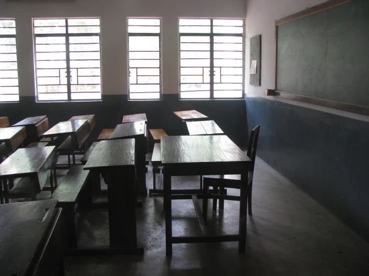 a classroom with a chalkboard in the background