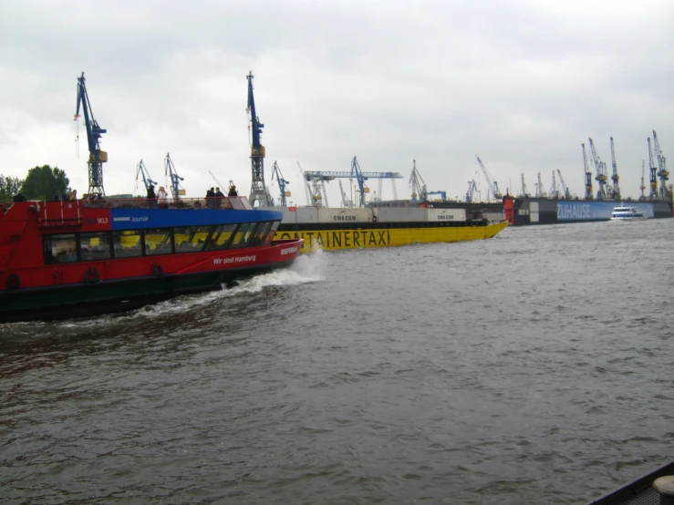 a large red and blue boat in the water