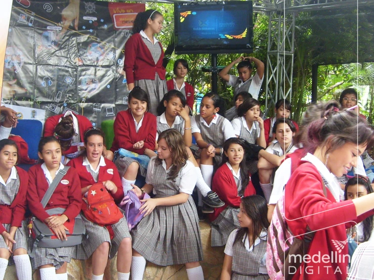 an image of a group of school girls sitting down