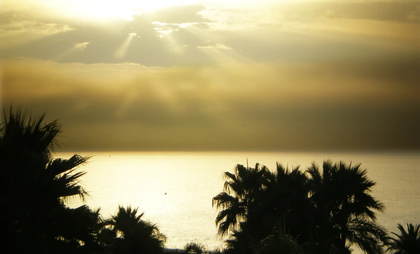 a view of the ocean and a cloudy sky