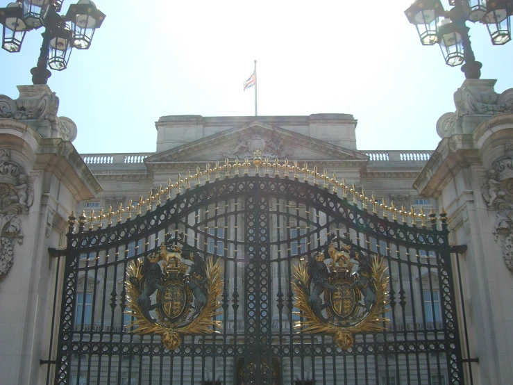 a beautiful gate with two statues in the middle