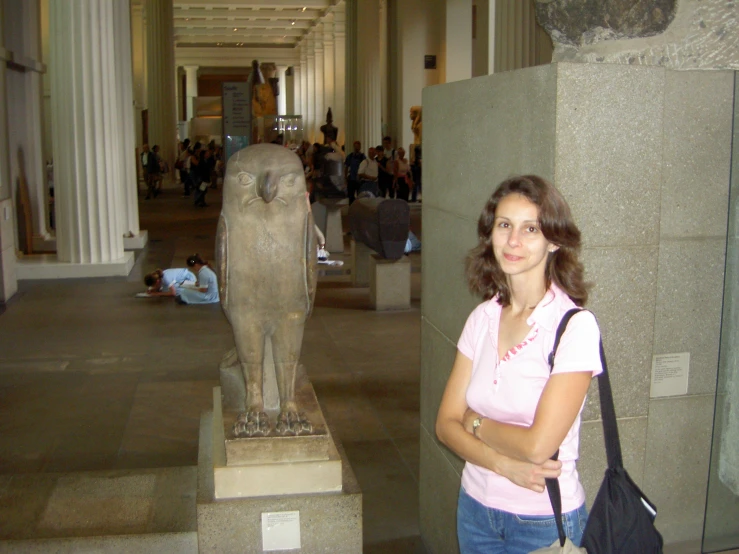 a person in a museum with an elephant statue