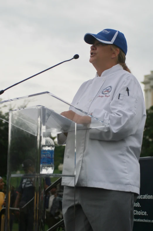 a man stands at a podium giving a speech