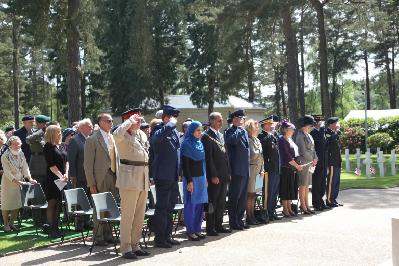 a group of people standing around each other