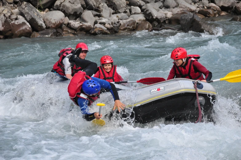 a group of men are in a raft