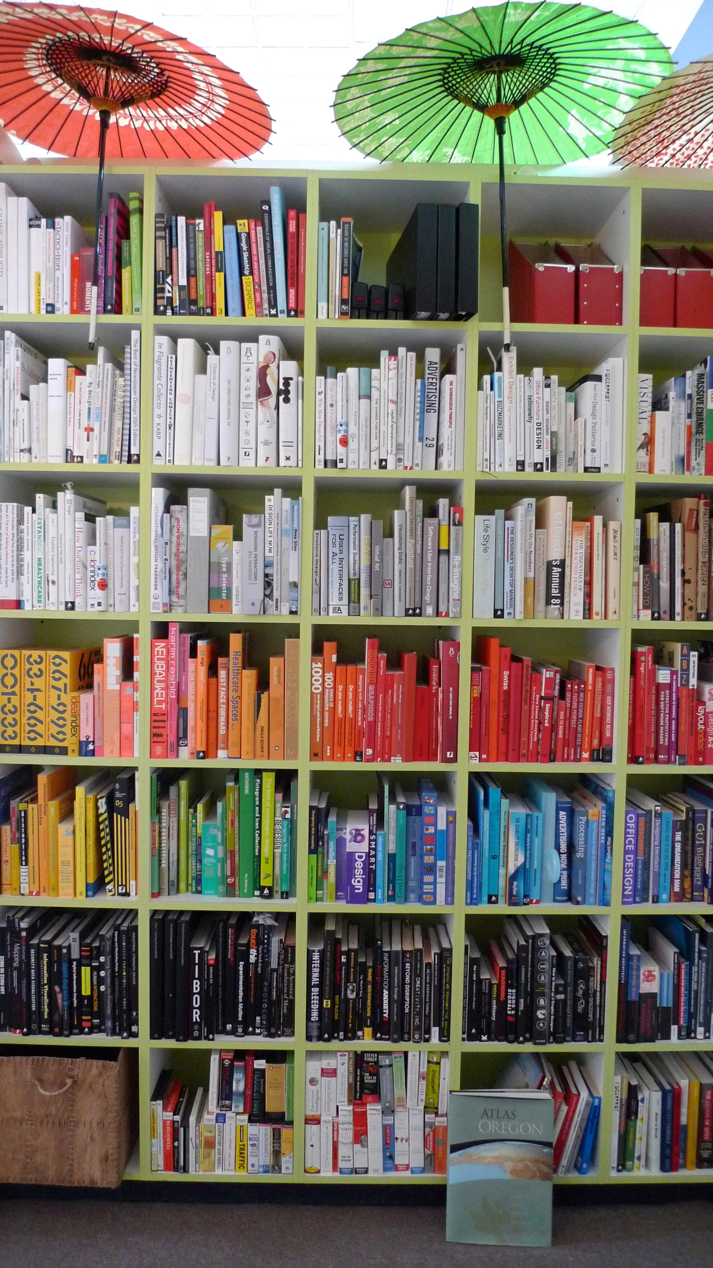 there are books on the shelves with umbrellas