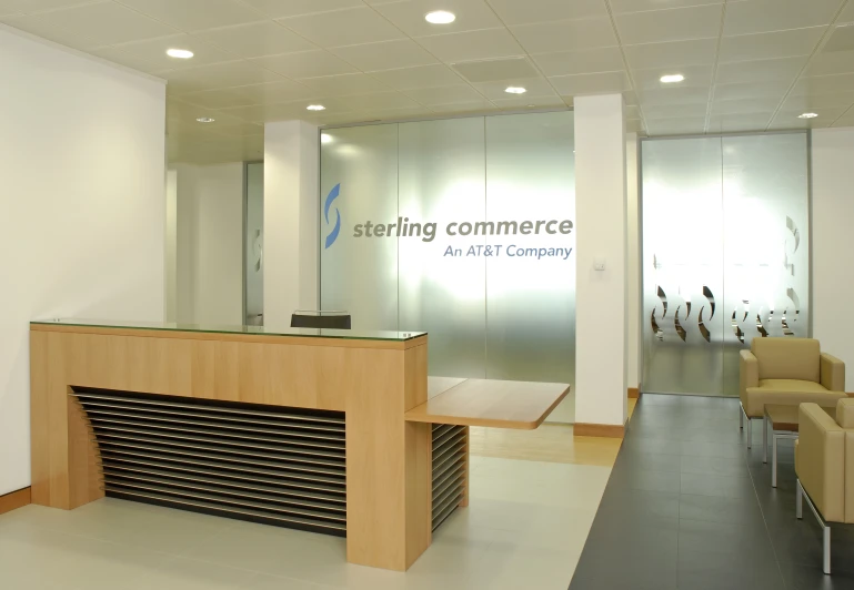 a reception area with chairs and a large counter