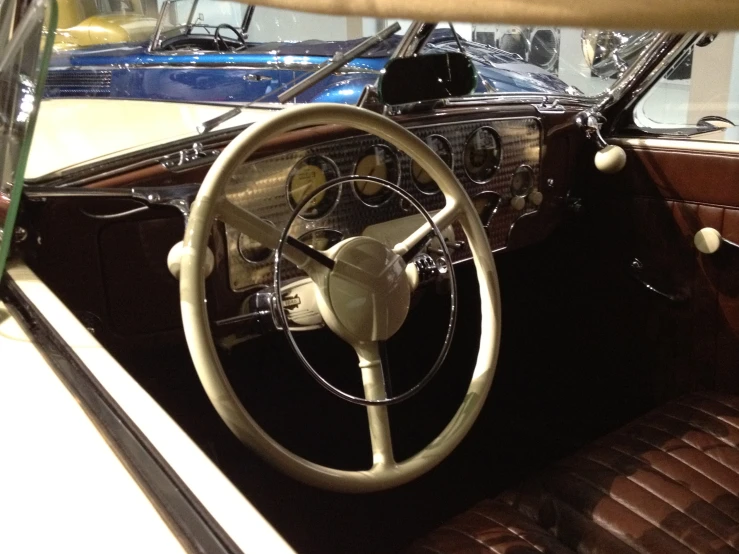 the interior of an old car with it's steering wheel showing
