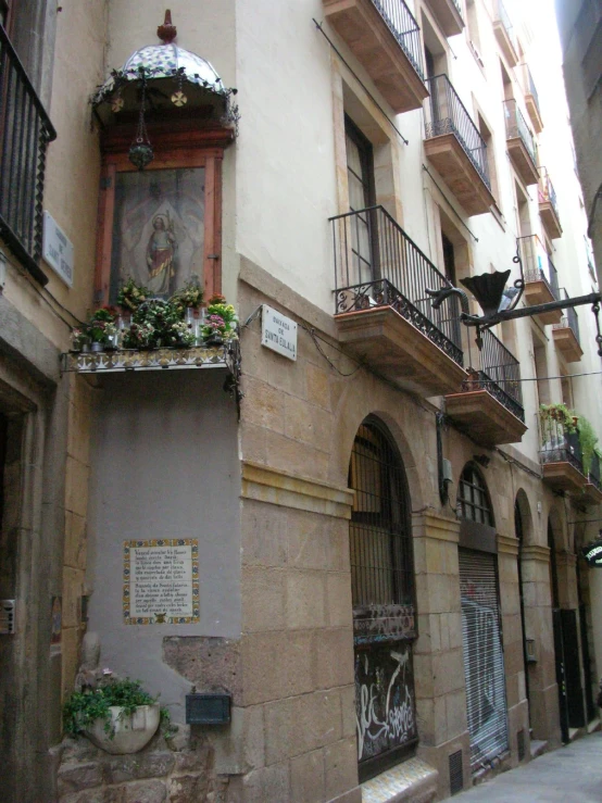 an image of the entrance to a building that is decorated with flower pots