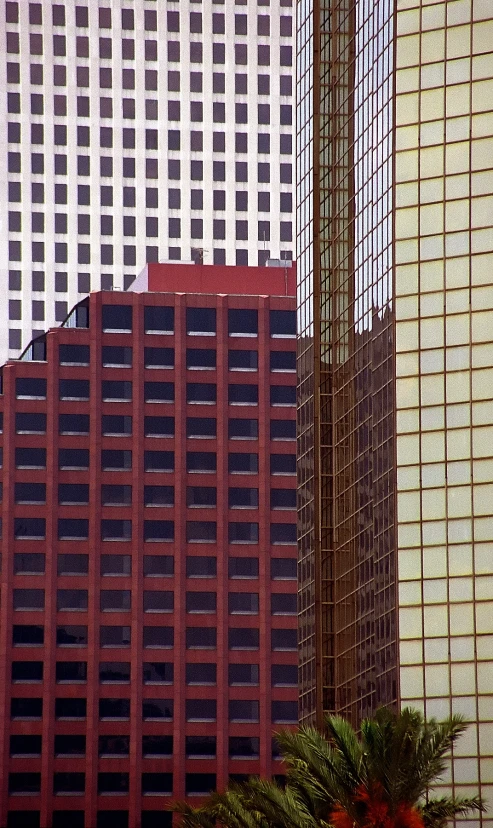 an airplane flies over buildings in the city