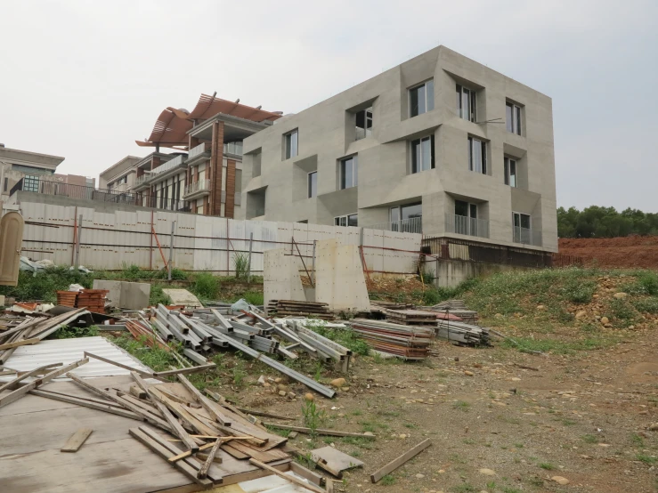 an abandoned area is shown next to several buildings