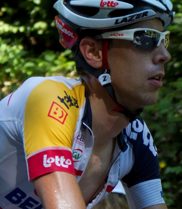 a man wearing a helmet and cycling glasses