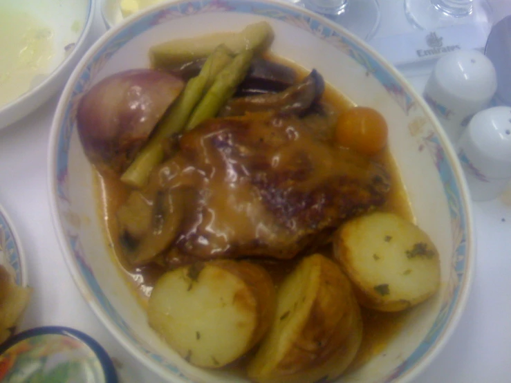 plate of food with meat, potatoes and asparagus