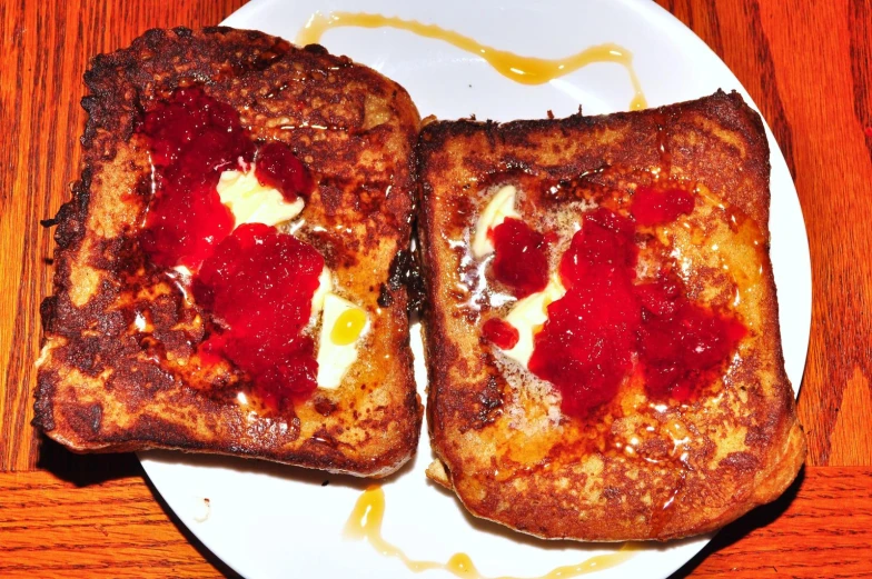 a couple of pieces of toast on top of a white plate