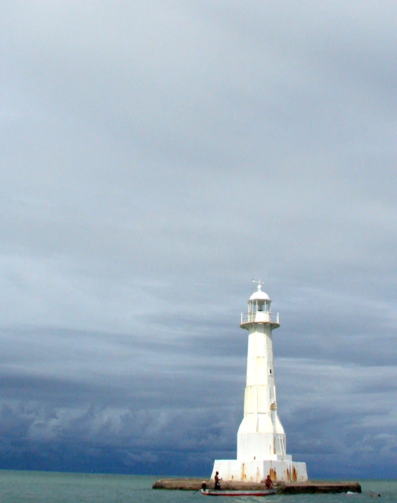 the lighthouse is on top of an old dock