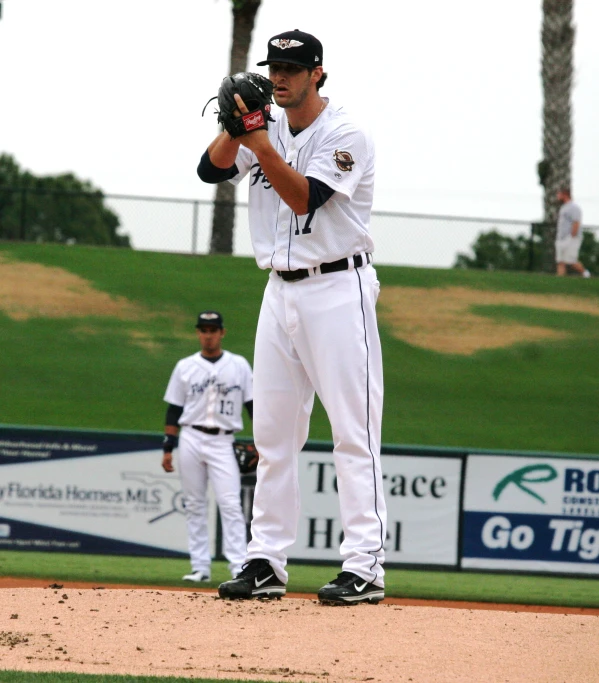 a baseball player wearing a catchers mitt during a game