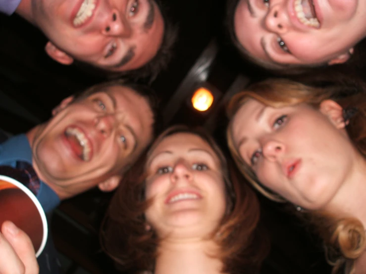 a close up of a group of people looking up