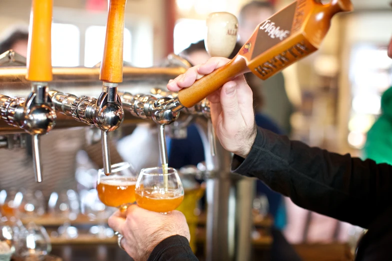 beer flight at the bar while some people wait